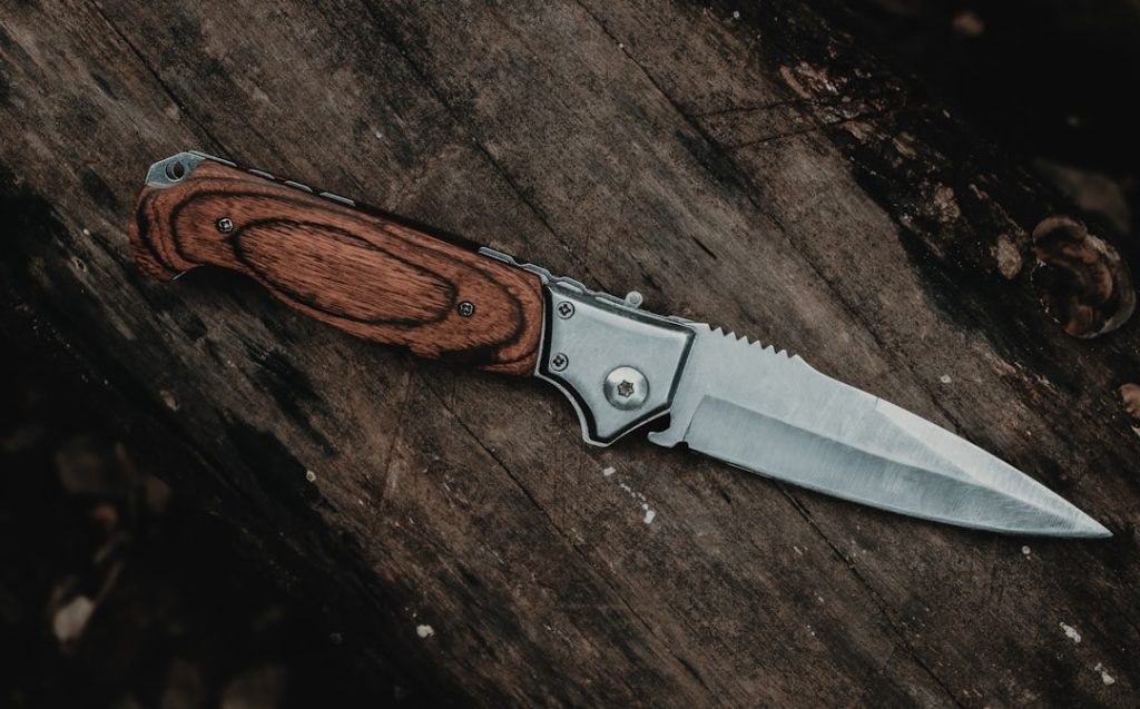 brown-handle-silver-knife-on-brown-wooden-table-sv5jrc3t71m